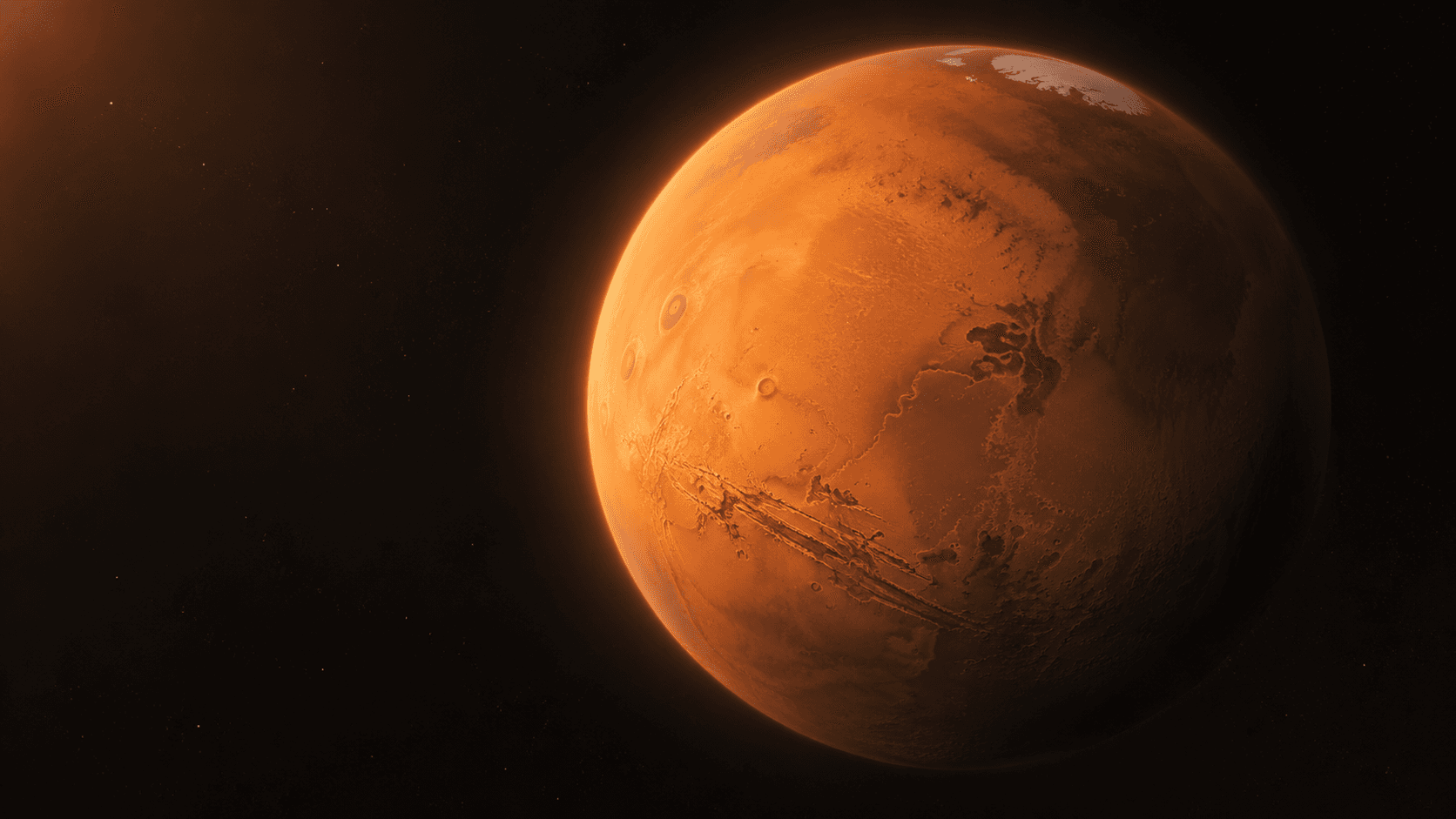 Mars showing its red cratered surface, polar ice and vast canyon system
